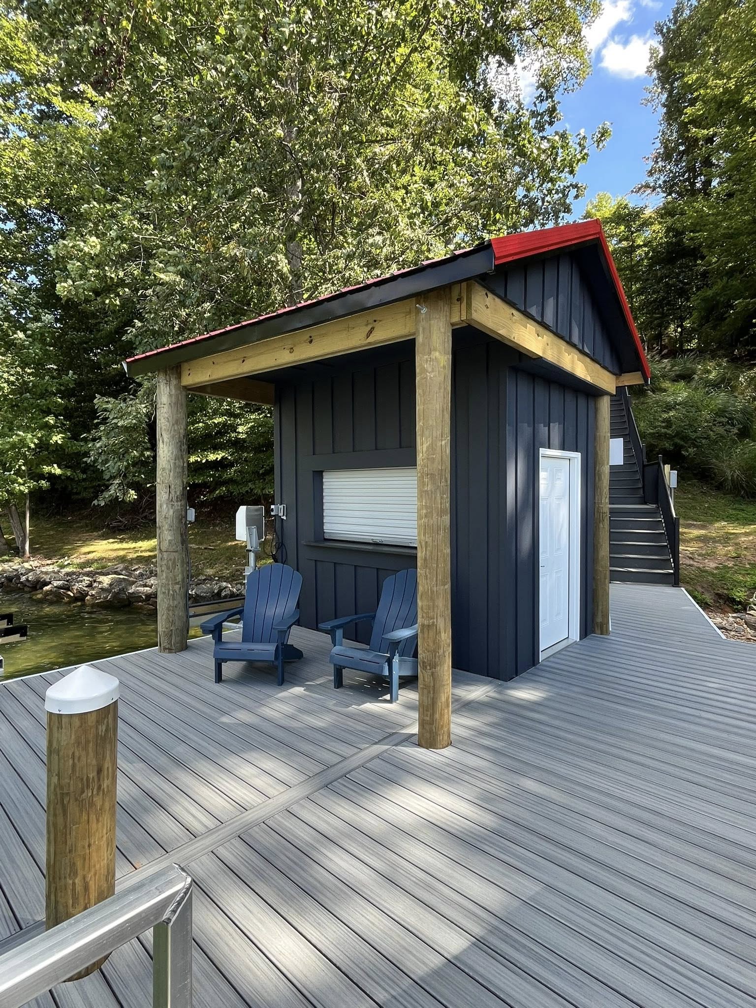 Lakeside entertaining space with integrated swim platform and rail lighting.
