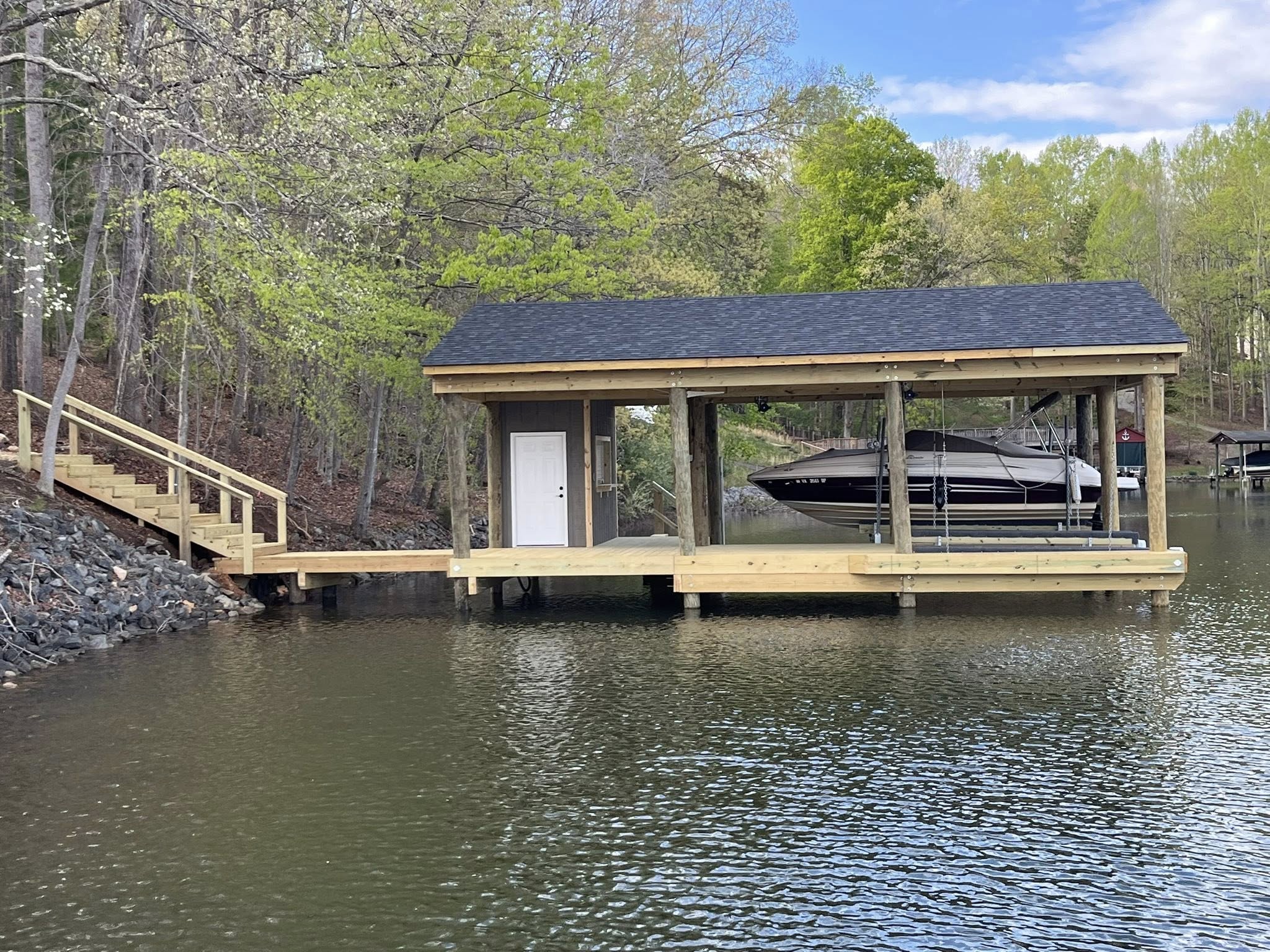 Structural repair and resurfacing of an aging fixed dock after storm damage.